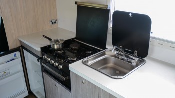 4-berth Fuso Kitchen with Gas cooker & grill, and 3-way auto fridge